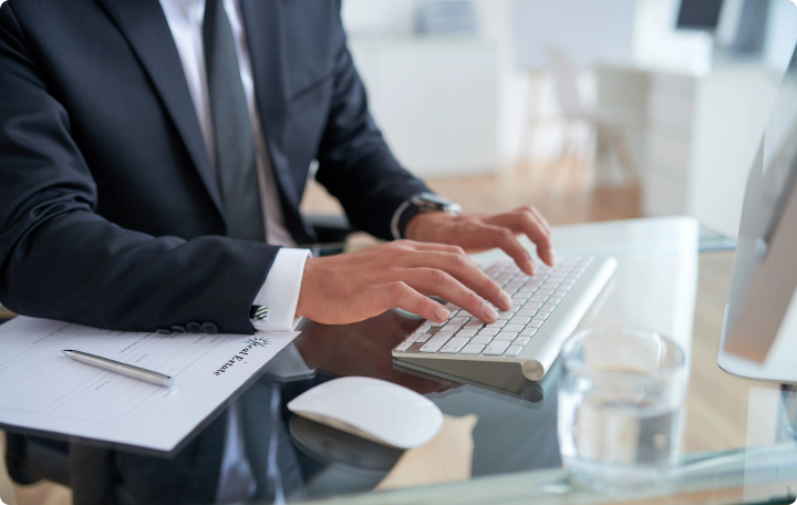 unrecognizable-businessman-typing-keyboard-office