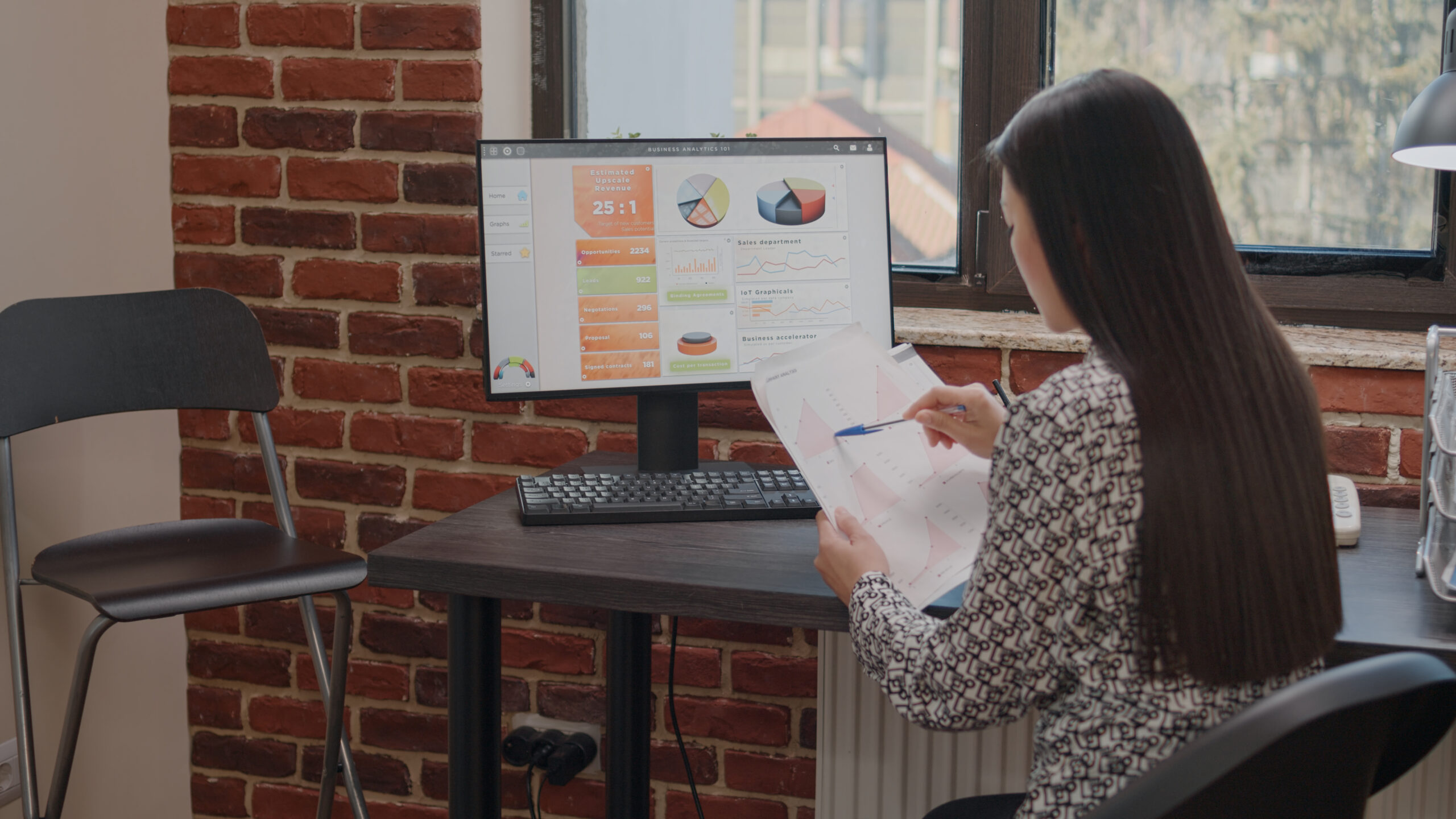 Close up of employee working with charts on papers